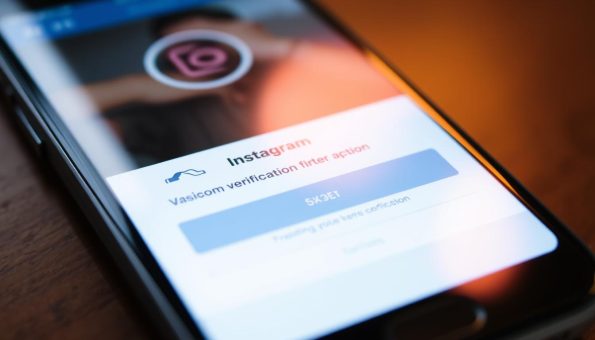 A close-up view of a smartphone screen displaying the Instagram verification code entry form. The screen is brightly lit, casting a warm glow on the device's glass surface. The form fields are prominently featured, inviting the user to input the required code. The background is slightly blurred, emphasizing the verification task at hand. The overall mood is one of anticipation and focus, as the user navigates the common challenge of gaining access to their Instagram account. A close-up view of a smartphone screen displaying the Instagram verification code entry form. The screen is brightly lit, casting a warm glow on the device's glass surface. The form fields are prominently featured, inviting the user to input the required code. The background is slightly blurred, emphasizing the verification task at hand. The overall mood is one of anticipation and focus, as the user navigates the common challenge of gaining access to their Instagram account.